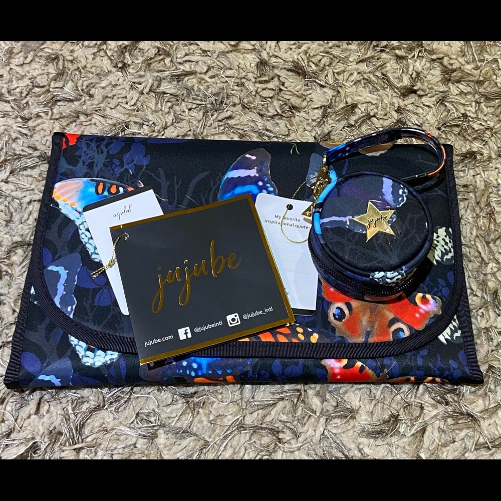 Jujube changing pad and pacifier holder